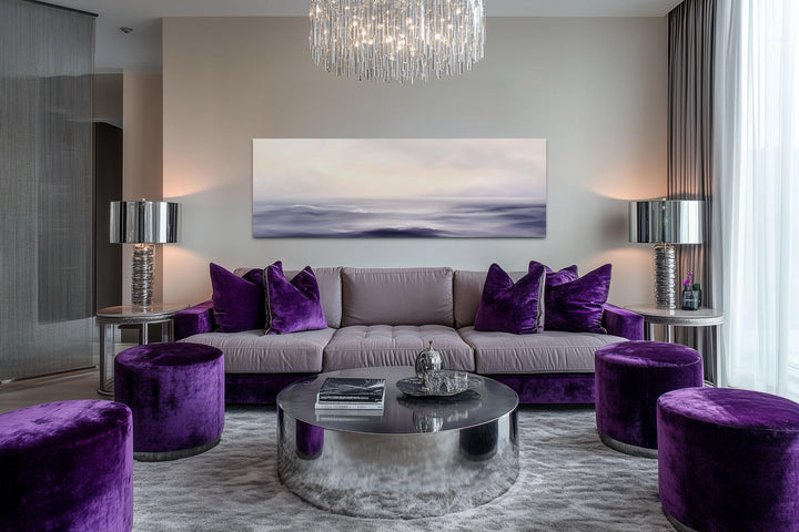 Purple Ocean Waves Long Horizontal Coastal Canvas Wall Art above a purple sofa in a living room.