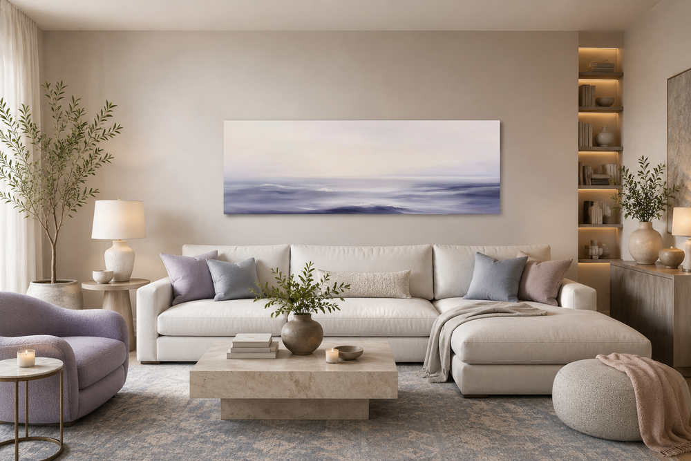 Purple Ocean Waves long horizontal coastal canvas wall art above a white sofa in a modern room.