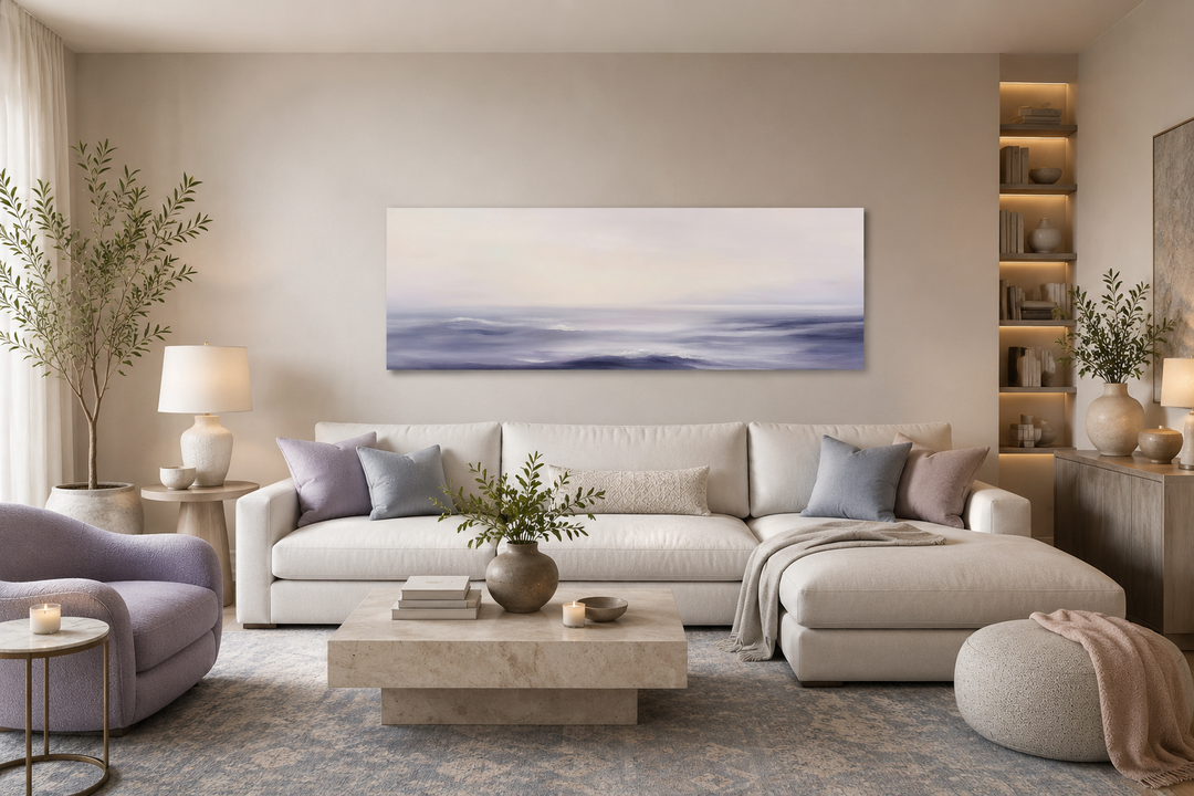 Purple Ocean Waves long horizontal coastal canvas wall art above a white sofa in a modern room.