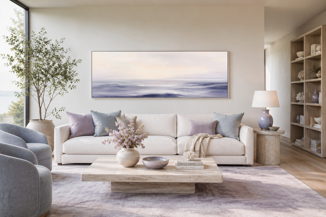 Purple Ocean Waves long horizontal coastal canvas wall art above a white sofa in a modern room.