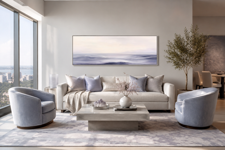 Purple Ocean Waves long horizontal coastal canvas wall art above a sofa in a modern living room.