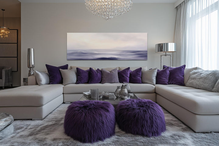 Purple Ocean Waves long horizontal coastal canvas wall art hanging above a modern sofa.