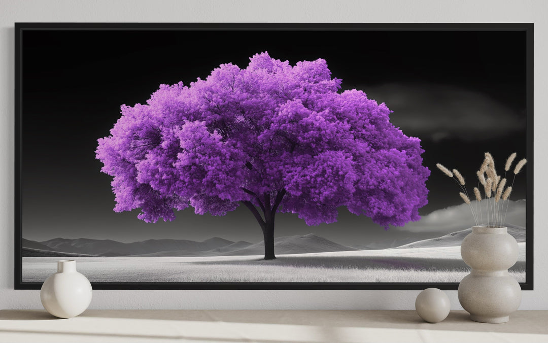 Framed canvas wall art featuring a vibrant purple tree against a black and white landscape.