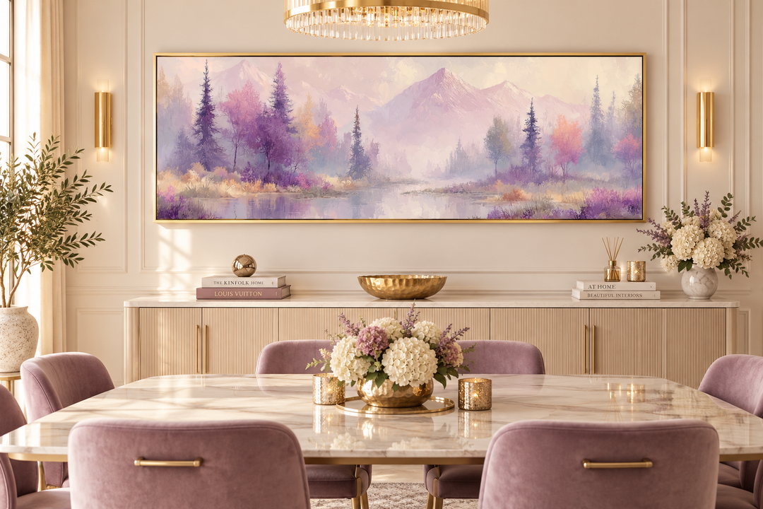 Long horizontal wall art of a purple lake landscape with mountains and trees above a dining table.