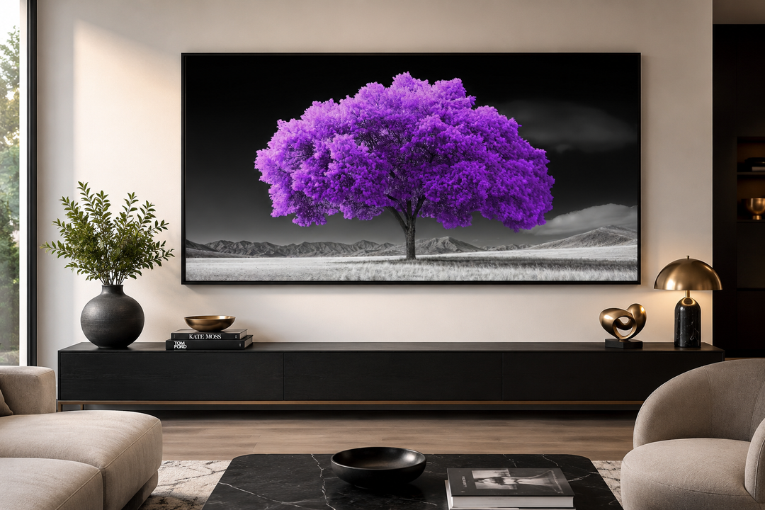 Purple tree on black and white landscape background framed canvas wall art in a modern living room.