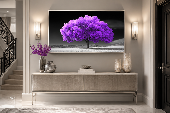 Framed canvas wall art of a vibrant purple tree against a black and white landscape background.