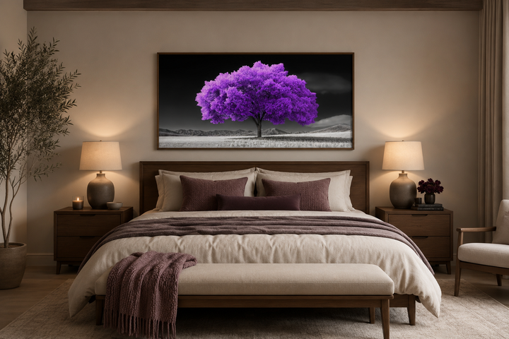 Purple tree on black and white background framed canvas wall art above a bed in a modern bedroom.