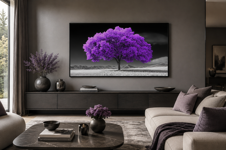 Framed canvas wall art of a vibrant purple tree against a black and white landscape background.