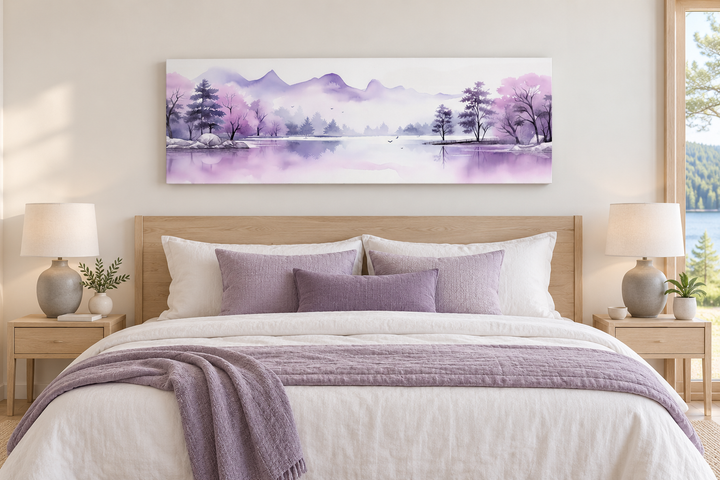 Purple mountains lake watercolor canvas art hanging above a bed in a serene bedroom.