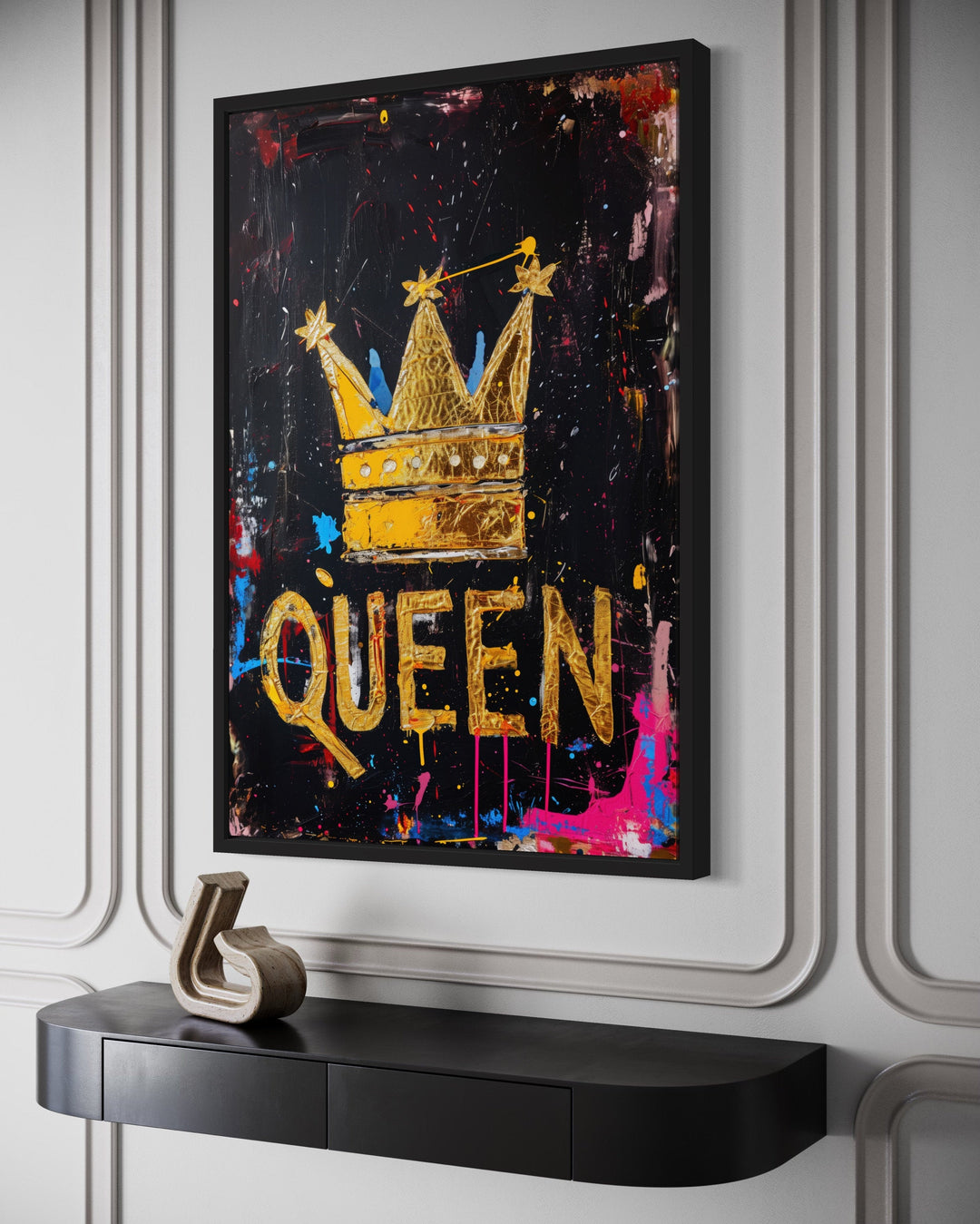 Queen wall art featuring a gold crown and typography on a black canvas with colorful paint splatters.