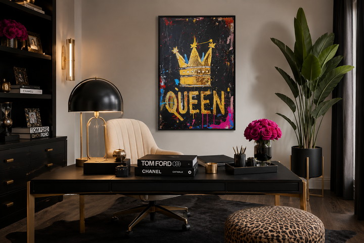 Queen wall art with a gold crown and word Queen on a black canvas in a modern office setting.