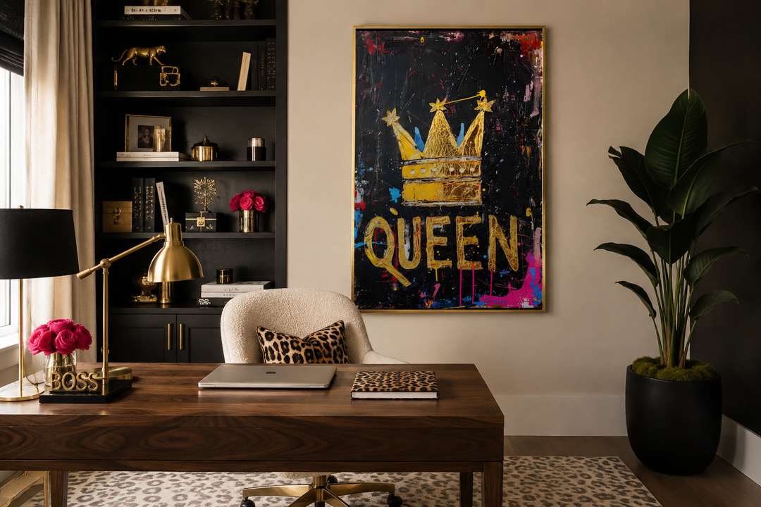 Queen wall art with a gold crown and the word Queen on a black canvas in a modern office setting.