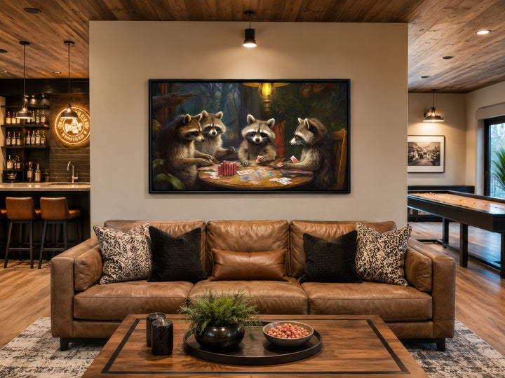 Raccoons playing poker framed canvas wall art hanging above a brown leather sofa in a man cave.