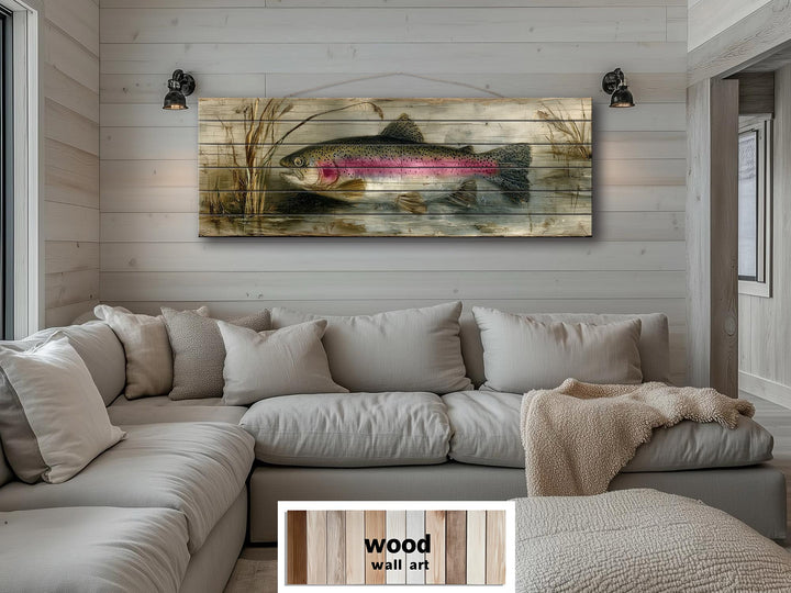Rustic wood wall art featuring a rainbow trout scene hanging above a neutral sectional sofa.