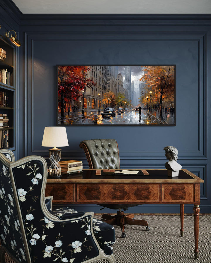 Rainy Chicago Street Framed Canvas Wall Art displayed above a wooden desk in a dark blue office.
