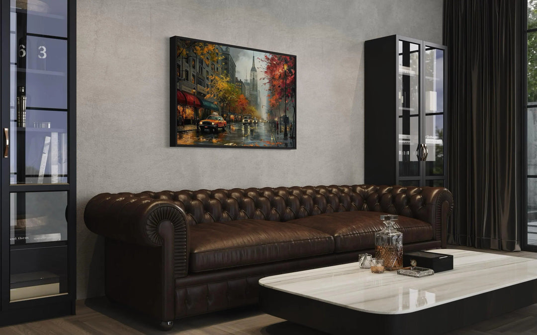 Rainy New York City Street Framed Canvas Wall Art hanging above a brown leather chesterfield sofa.