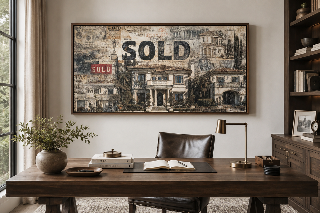 Real estate office wall art featuring a mansion money collage with a bold SOLD stamp over a desk.