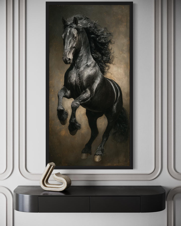Rearing black stallion framed canvas wall art in a traditional oil painting style on a white wall.