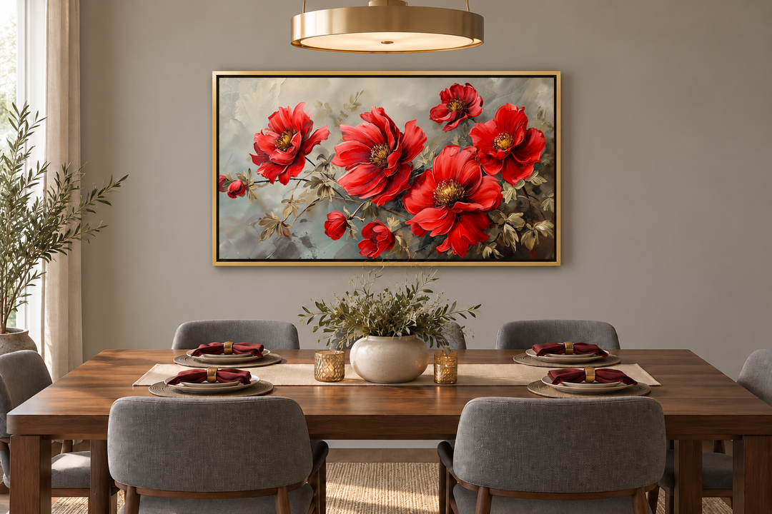 Red abstract flowers framed canvas wall art hanging above a dining table in a gold frame.