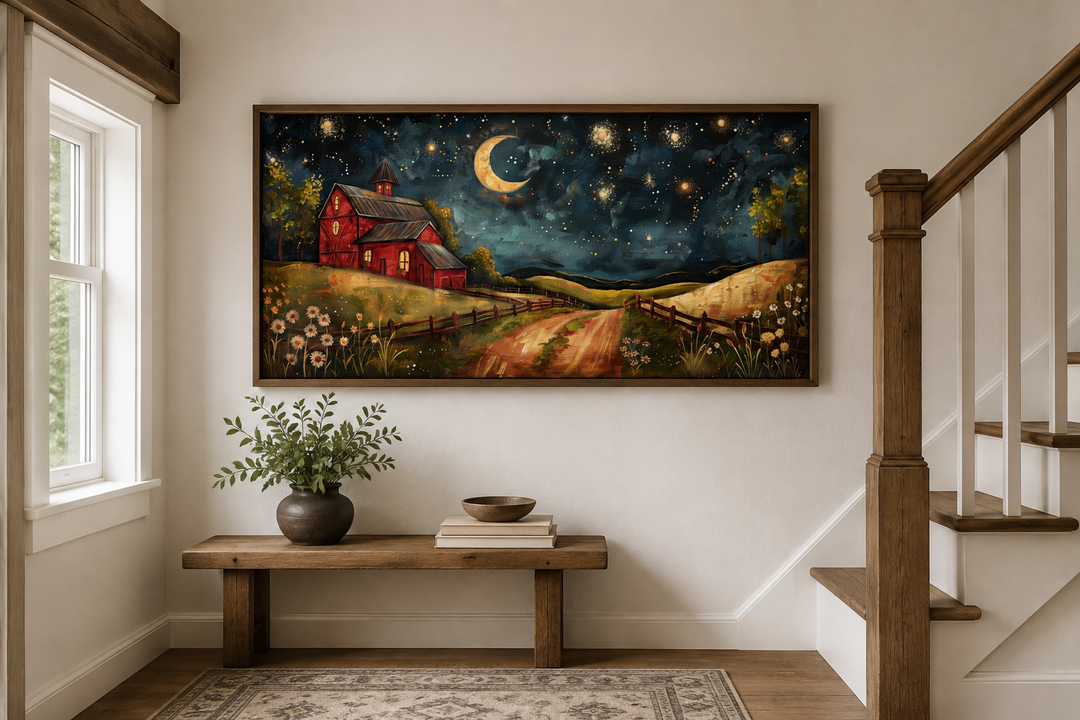 Red barn wall art under a starry night sky with a crescent moon, displayed above a wooden bench.
