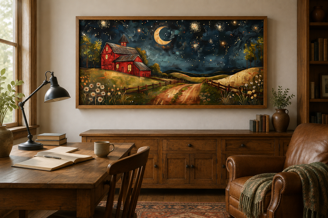 Framed wall art of a red barn under a crescent moon and starry night sky in a rustic study.