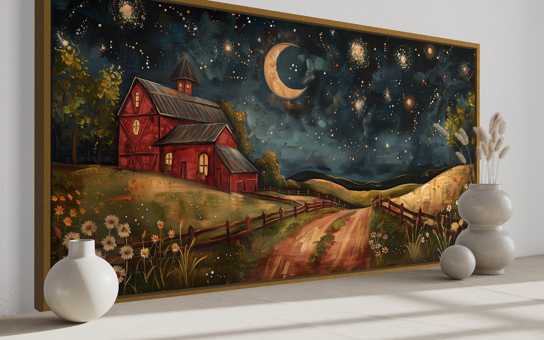 Red barn wall art under a starry night sky with a crescent moon and a dirt path.