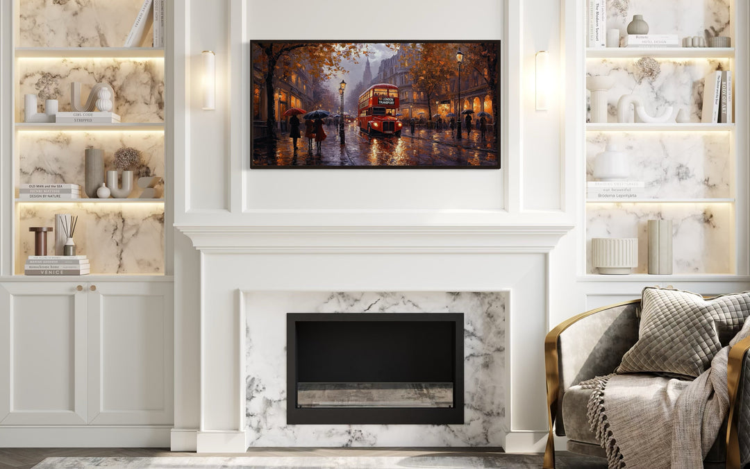 Framed canvas wall art of a red double decker bus in rainy London above a white fireplace.