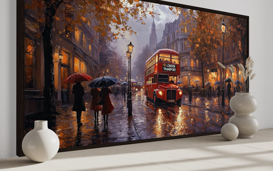 Impressionist framed canvas art of a red double-decker bus on a rainy London street with pedestrians.