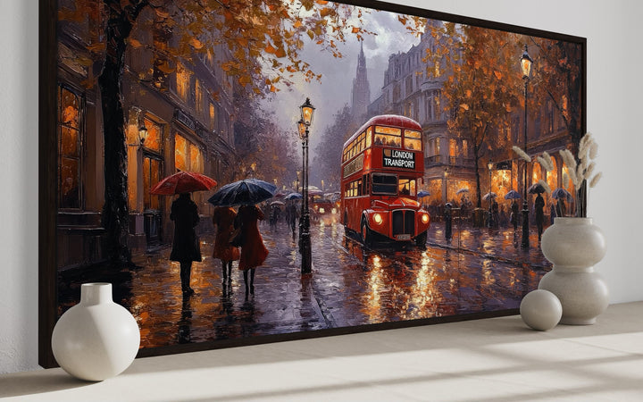 Impressionist framed canvas art of a red double-decker bus on a rainy London street with pedestrians.