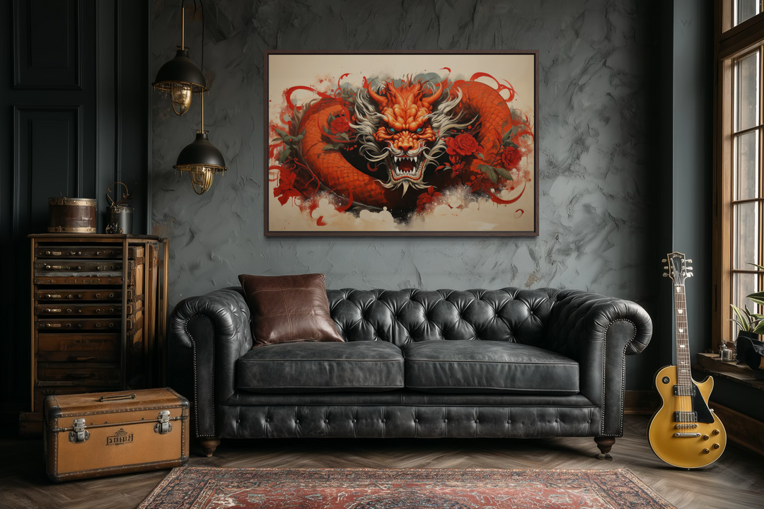 Framed canvas wall art featuring a red dragon graffiti design above a black leather sofa.