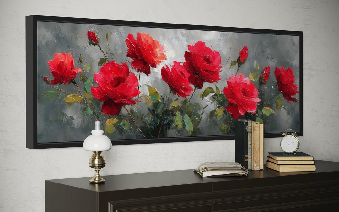 Red and grey horizontal roses framed canvas wall art above a dark wood console table.