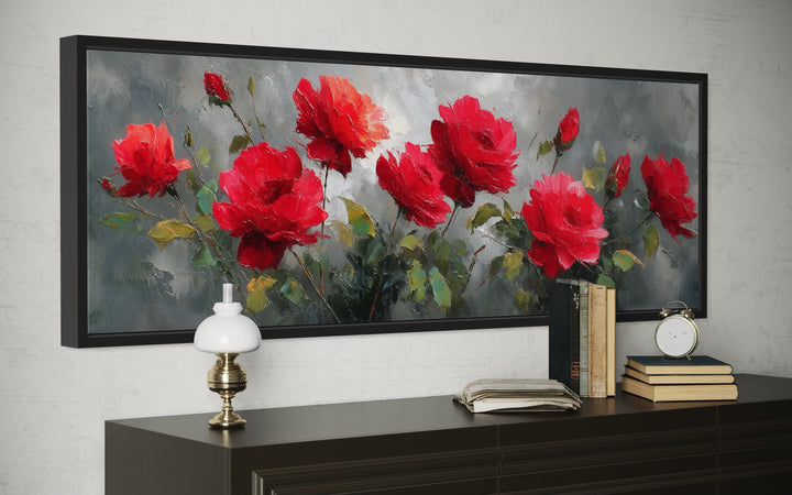 Red and grey horizontal roses framed canvas wall art above a dark wood console table.