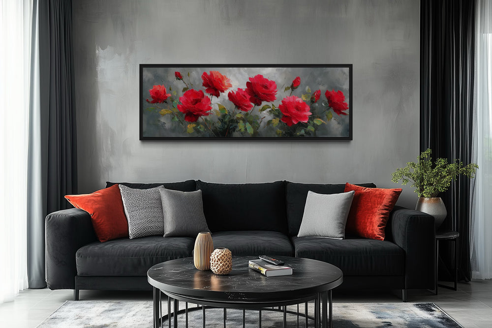 Red and grey horizontal roses framed canvas wall art hanging above a black sofa in a modern room.