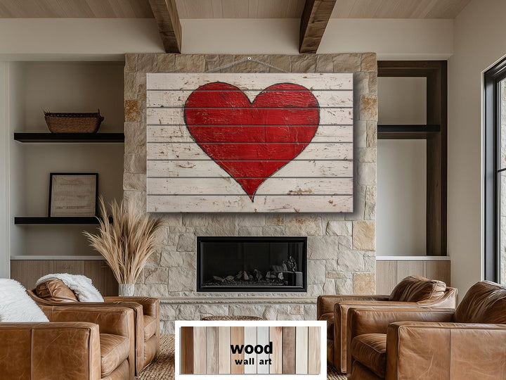 Rustic red heart painted on whitewashed wood planks, hanging above a stone fireplace.