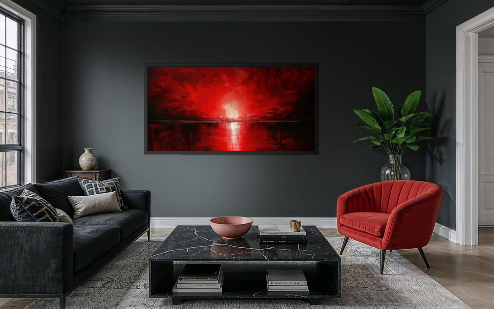 A large framed canvas wall art featuring an abstract red ocean sunset in a modern living room.