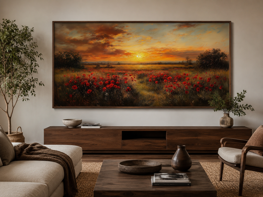 Panoramic canvas art of a red poppy field at sunset, framed above a modern wooden console.