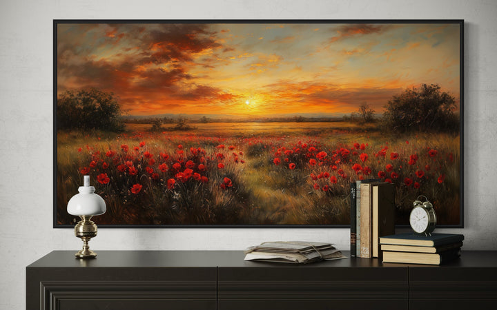 Panoramic canvas wall art of a red poppy field at sunset with a warm golden sky and rustic frame.