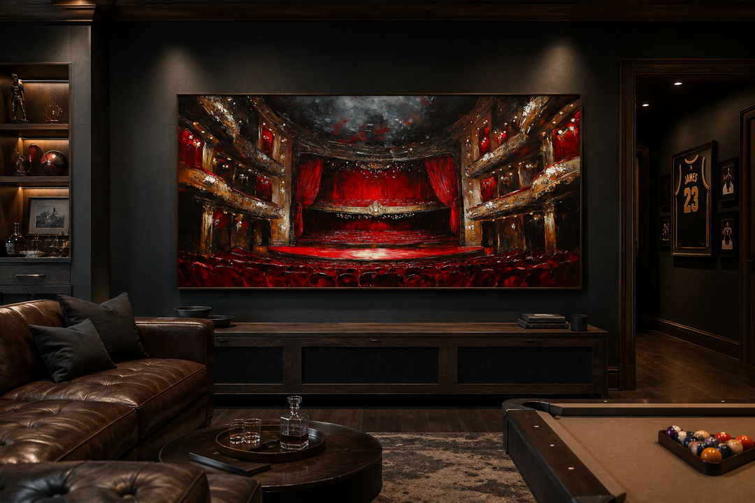Framed canvas wall art of a red theater stage and seats in a dark, modern home theater room.