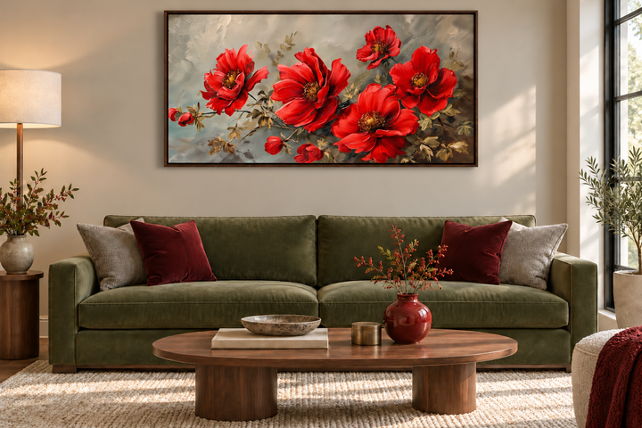 Red abstract flowers framed canvas wall art hanging above a green sofa in a modern living room.