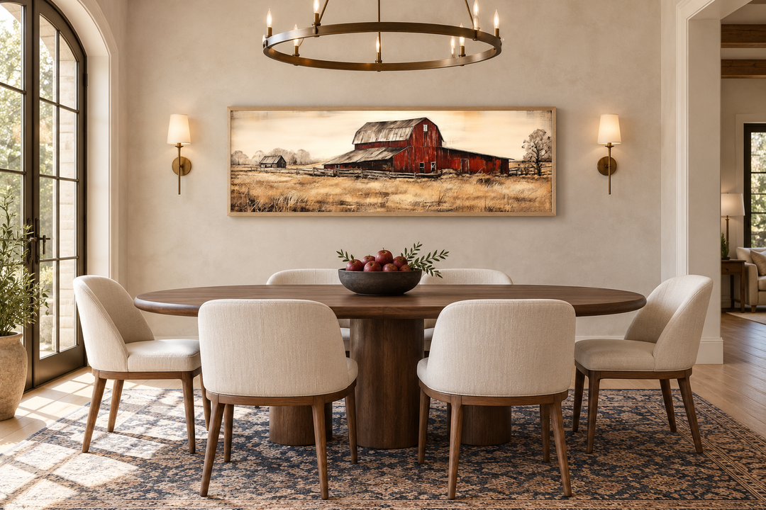 Old Red Barn rustic painting on horizontal framed canvas above a dining table in a farmhouse room.