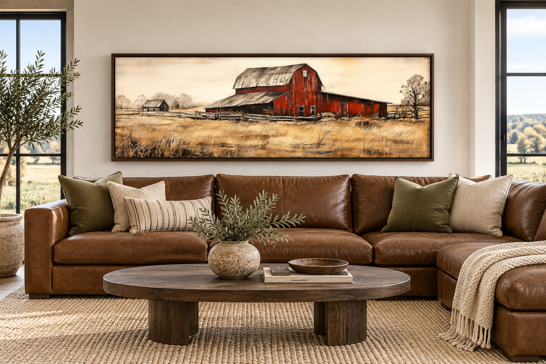 Old Red Barn rustic horizontal framed canvas wall art displayed above a brown leather sofa.