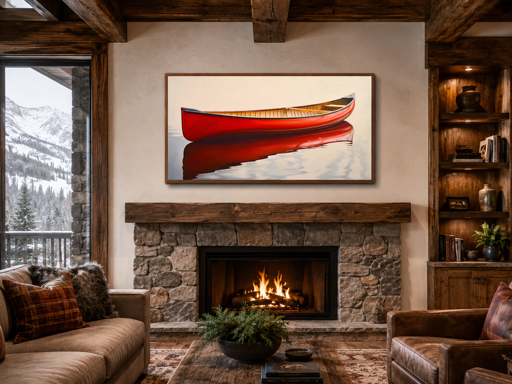 Rustic red canoe framed canvas print hanging above a stone fireplace in a cozy cabin living room.