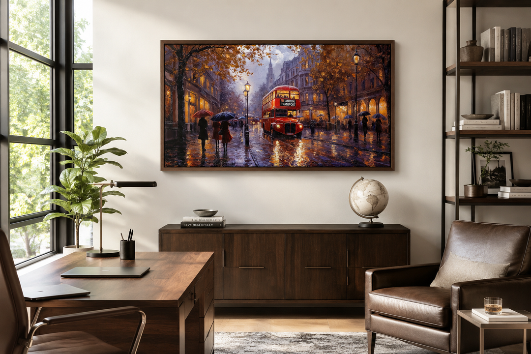 Framed canvas wall art of a red double decker bus on a rainy London street in a home office.