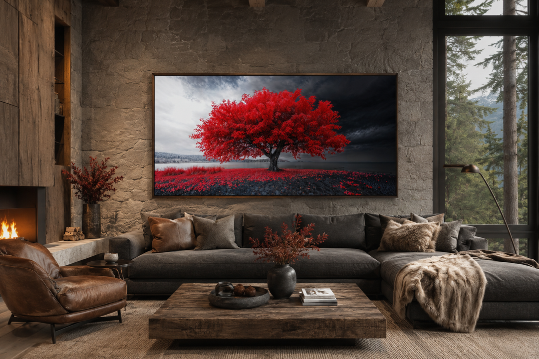 Framed canvas print of a vibrant red tree against a monochrome landscape in a modern living room.