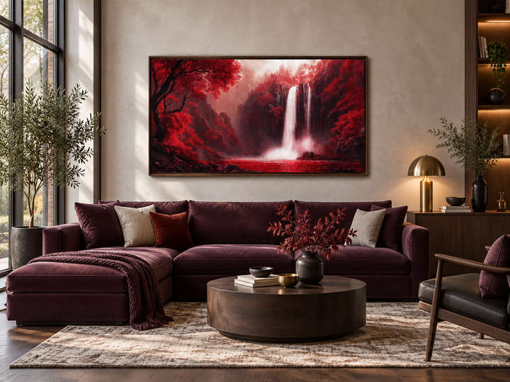 Red waterfall framed canvas wall art hanging above a burgundy sectional sofa in a modern room.