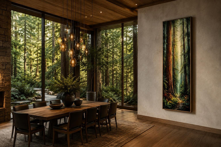 Tall narrow vertical canvas art of a redwood forest hanging in a modern rustic dining room.