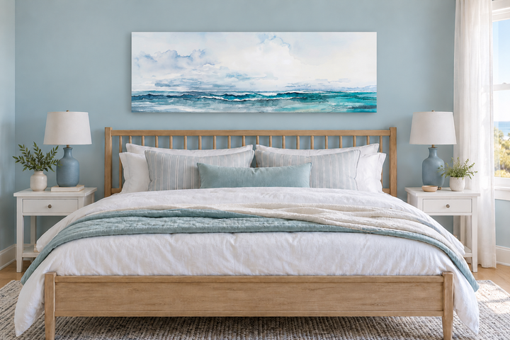 Minimalist ocean blue and gray horizontal framed canvas wall art hanging over a wooden bed frame.