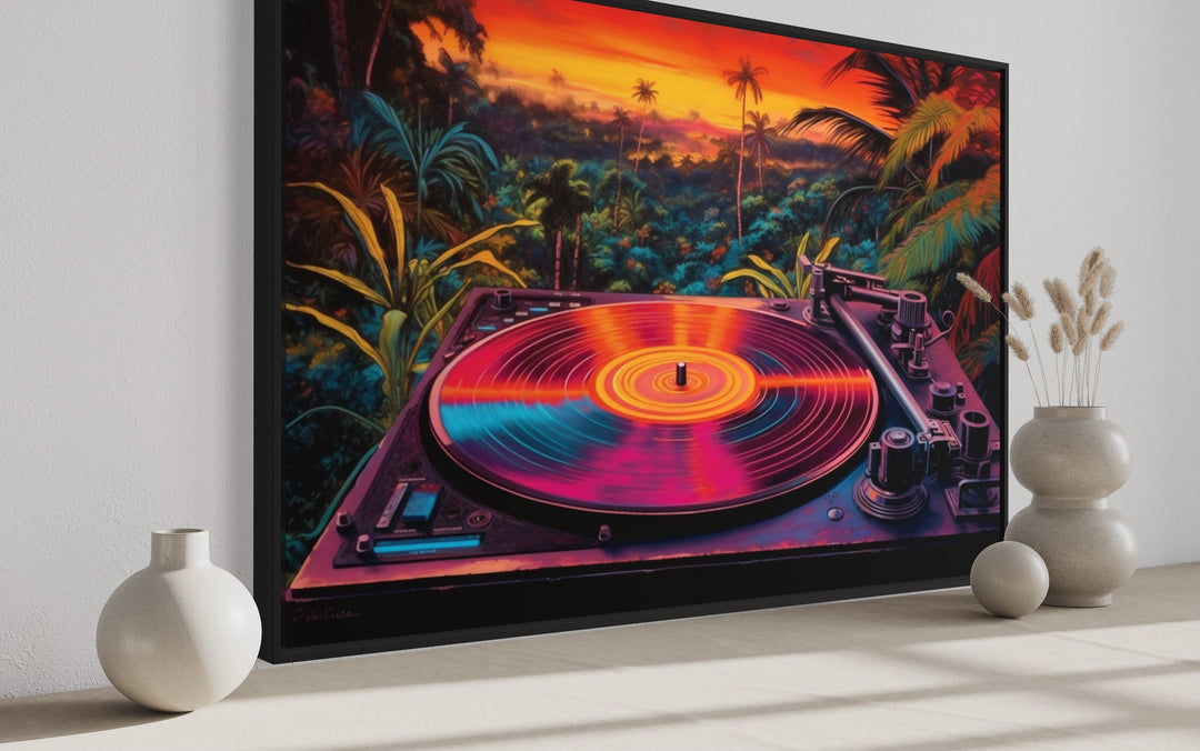 Framed canvas art of a colorful vinyl record player against a tropical synthwave sunset background.