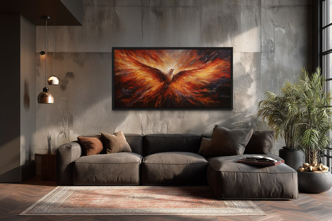 Rising Phoenix extra large orange framed canvas wall art above a dark sofa in a modern living room.