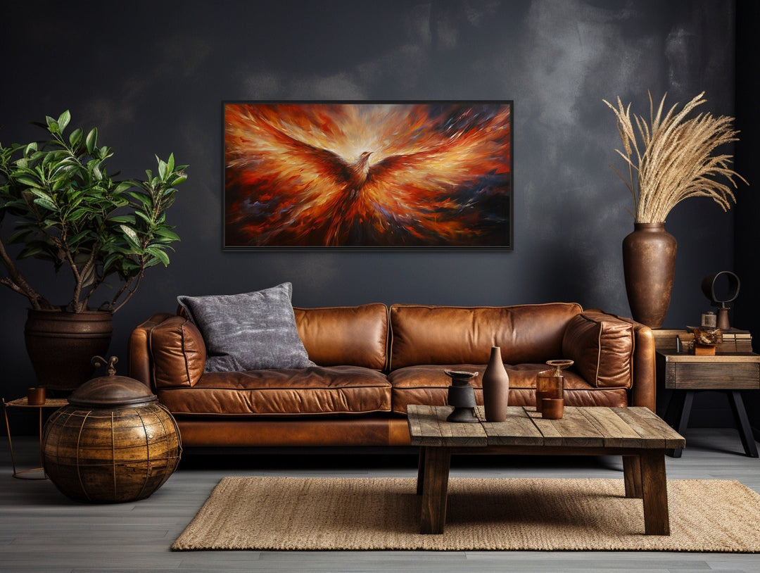 Rising Phoenix extra large orange framed canvas wall art above a brown leather sofa in a living room